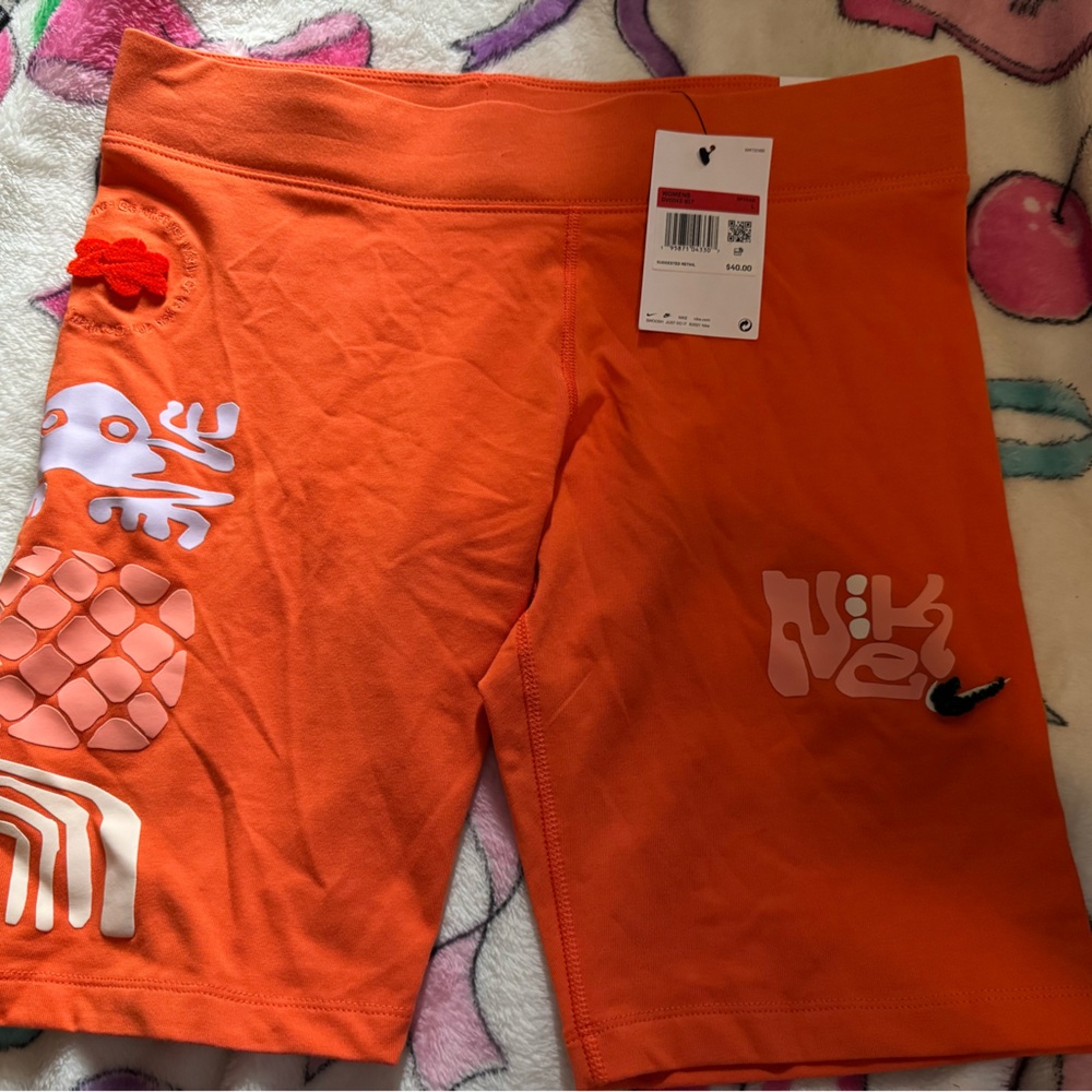 Nike Orange Graphic Athletic Shorts with White Accents